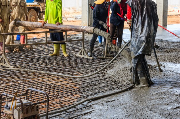 concrete-pouring-during-commercial-concreting-floors-buildings-construction-site_29285-1531