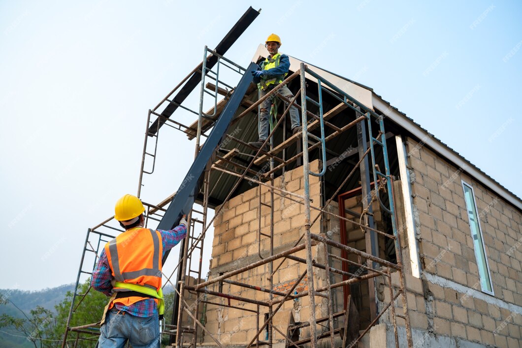 construction-worker-wearing-safety-harness-safety-line-working-scaffolding-new-house-construction_64073-973