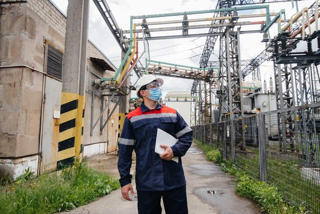 electrical-substation-engineer-inspects-modern-high-voltage-equipment-mask-time-pondemia-energy-industry_180601-10849