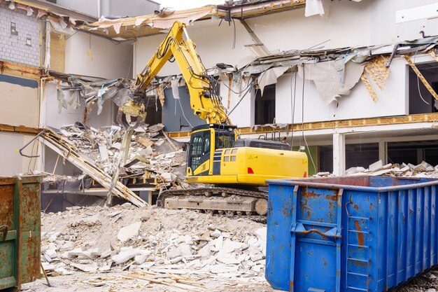 hydraulic-excavator-working-demolition-old-industrial-building_29285-264