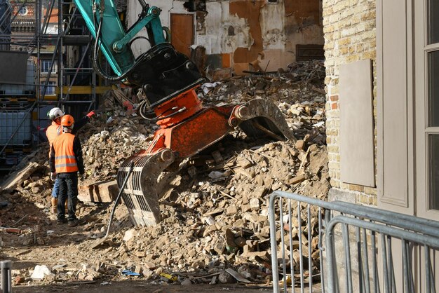 ruined-destroyed-house-excavator-destroys-house-with-bucket_524824-2055